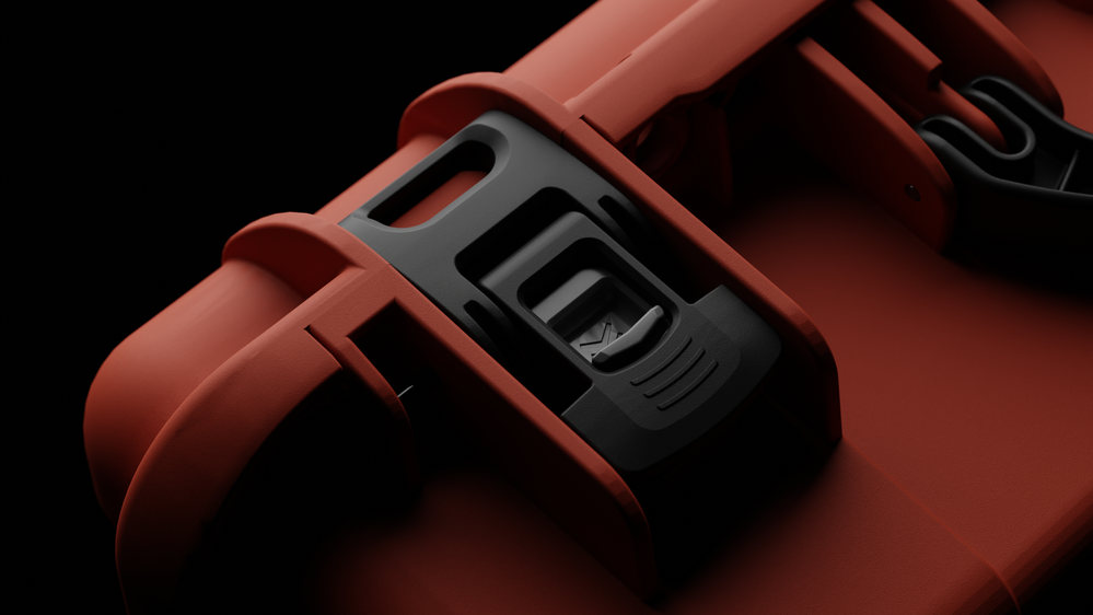 Close-up of a red tool with black accents on a dark background